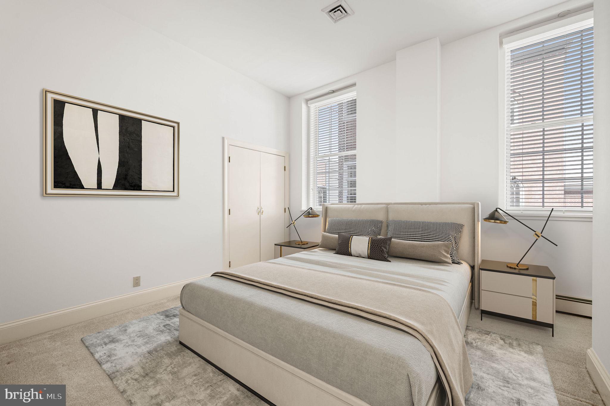211 South 4th Street, Unit 301 Philadelphia, PA 19106 - Photo 29 of 42 a bedroom with a bed a couch and a window