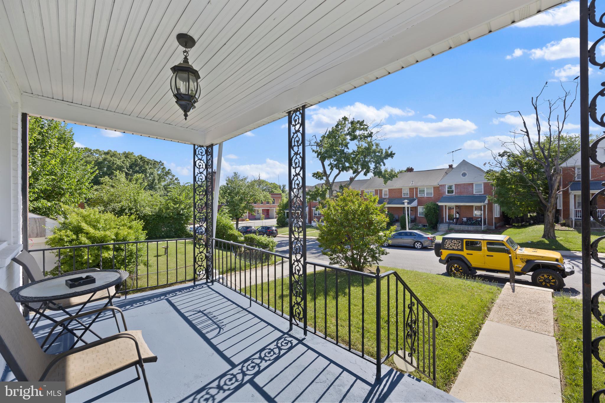 4511 Marble Hall Road Baltimore, MD 21239 - Photo 5 of 48 a view of a patio with couches potted plants and a table