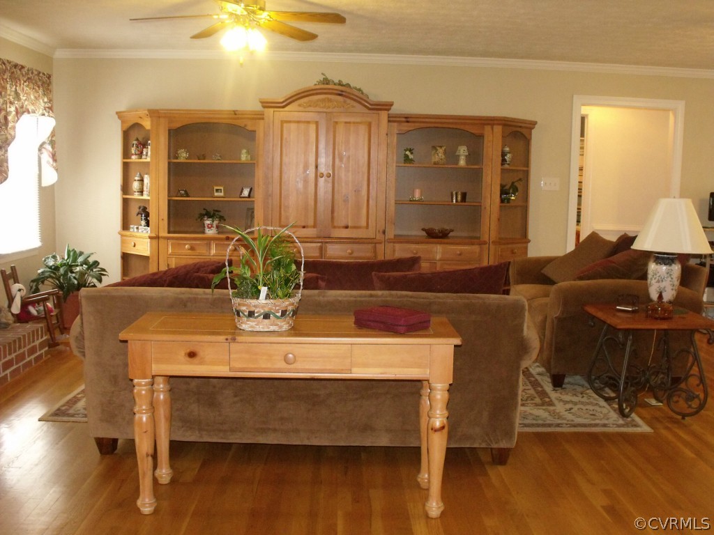 9811 Taylor Road Chesterfield, VA 23838 - Photo 11 of 24 a view of a dining room with furniture and wooden floor