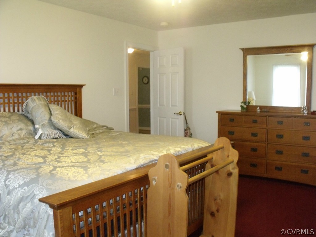 9811 Taylor Road Chesterfield, VA 23838 - Photo 17 of 24 a bedroom with a bed and a dresser