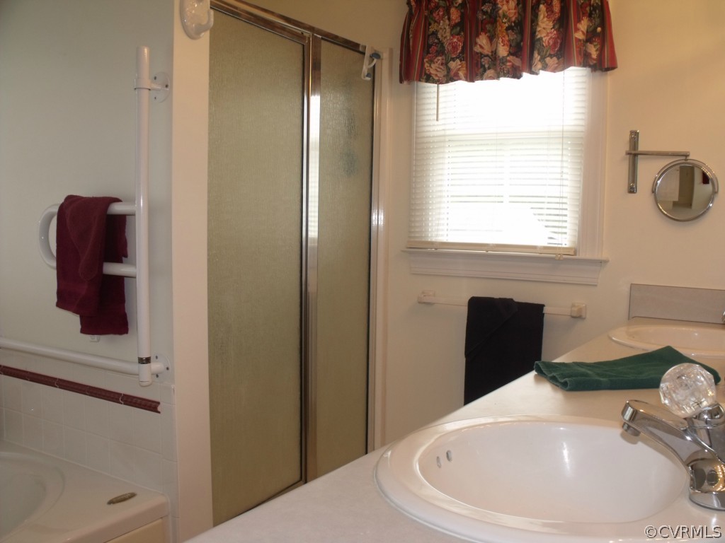 9811 Taylor Road Chesterfield, VA 23838 - Photo 21 of 24 a bathroom with a sink and a mirror