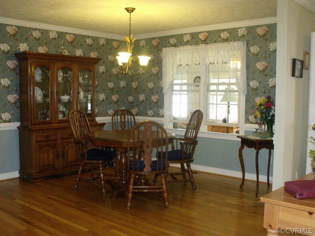 9811 Taylor Road Chesterfield, VA 23838 - Photo 10 of 24 a view of a dining room with furniture window and wooden floor