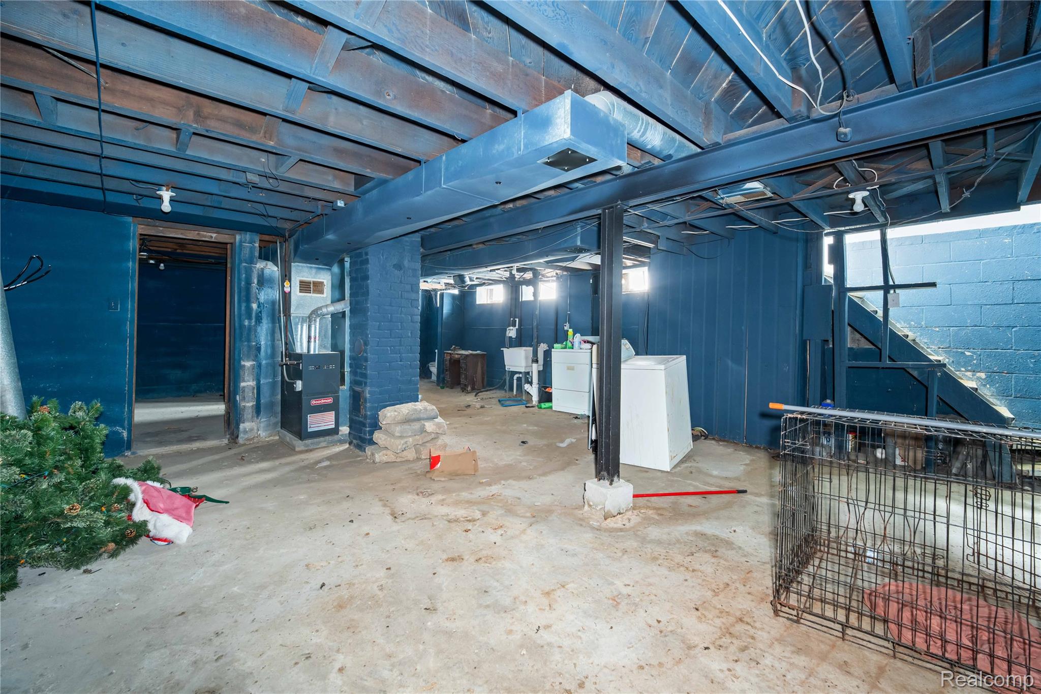 4049 Williams Street Inkster, MI 48141 - Photo 18 of 21 Unfinished below grade area with washer / dryer, concrete block wall, and heating unit