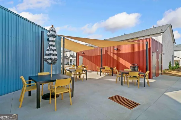 a view of a tables and chairs in patio