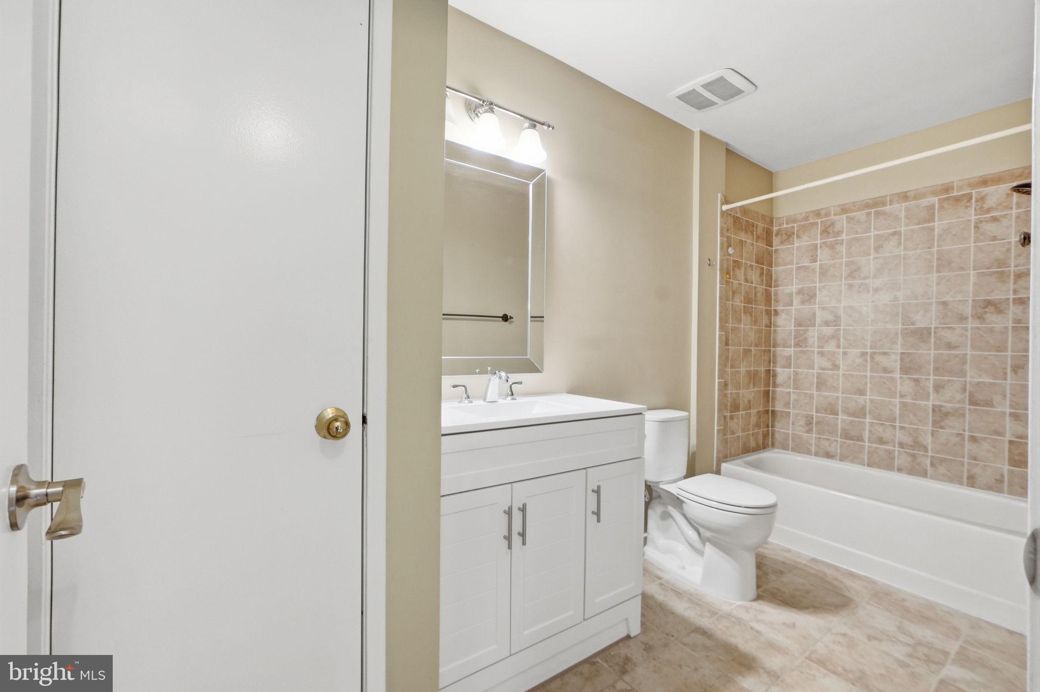 1968 Villaridge Drive Reston, VA 20191 - Photo 16 of 39 Updated bath with new vanity, toilet and mirror