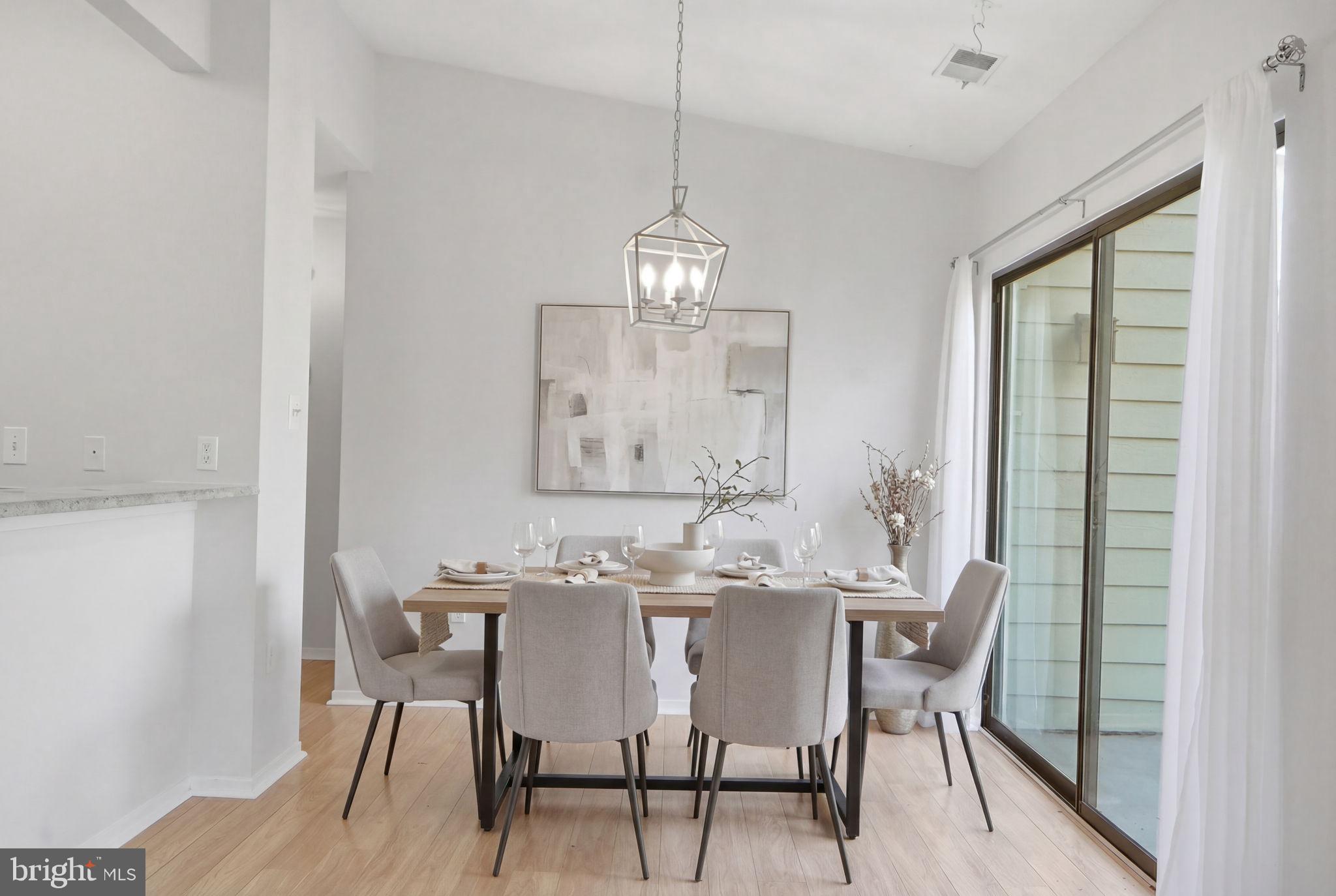 1968 Villaridge Drive Reston, VA 20191 - Photo 3 of 39 Dining Rm w/ SGD to balcony. Virtually staged