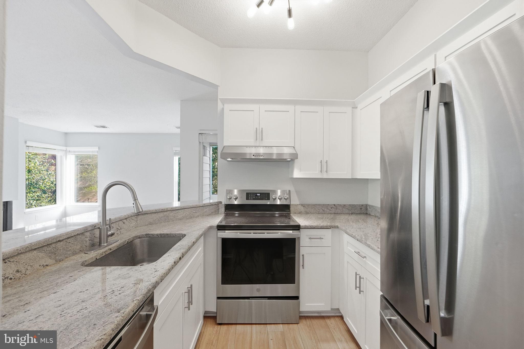 1968 Villaridge Drive Reston, VA 20191 - Photo 5 of 39 Kitchen w/ SS appliances & granite counters