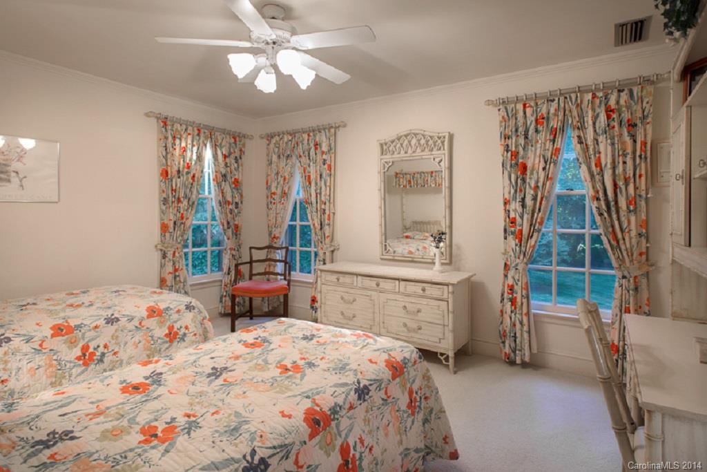 217 Neely Road Clover, SC 29710 - Photo 14 of 24 a bedroom with a bed and a chandelier