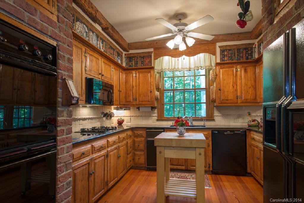 217 Neely Road Clover, SC 29710 - Photo 8 of 24 a kitchen with a sink stove and cabinets