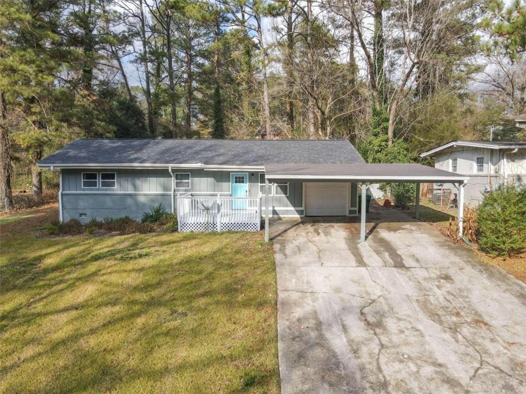 3672 Larkspur Terrace Decatur, GA 30032 - Photo 1 of 1 a view of a house with a yard plants and large tree