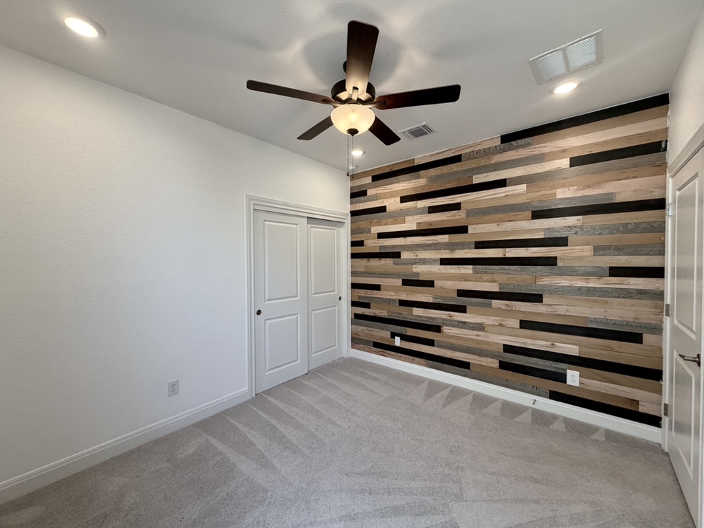 125 Slenderleaf Drive Marble Falls, TX 78654 - Photo 21 of 30 This unique wood wall is a focal point of one of the secondary bedrooms.