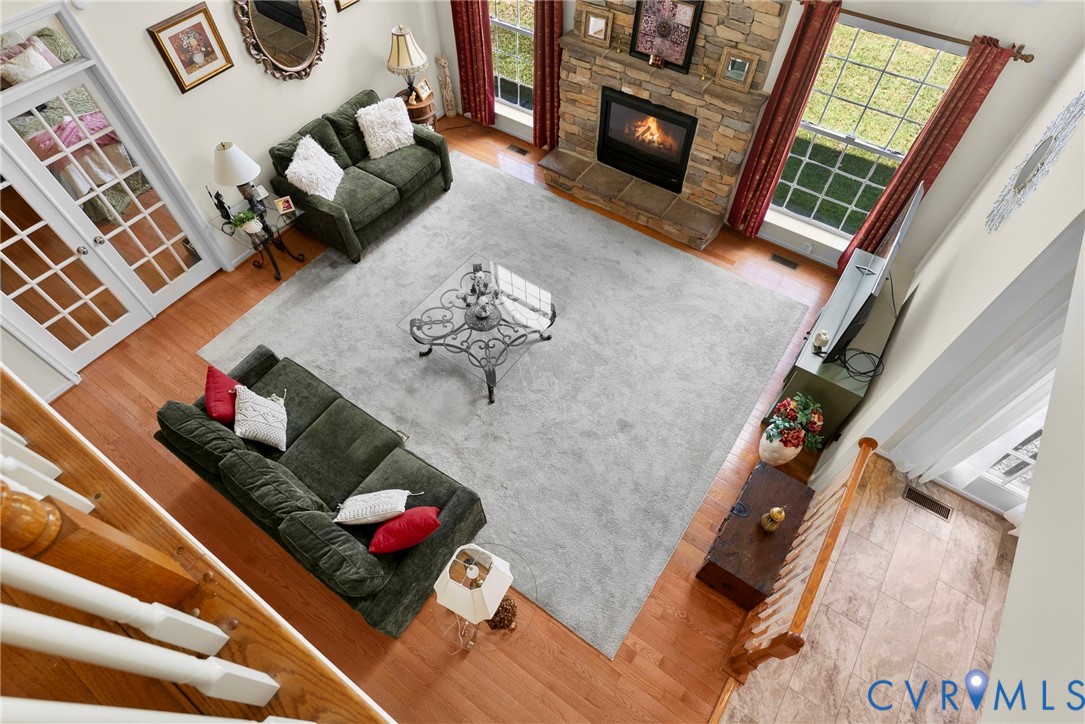 753 Blossom Tree Road Culpeper, VA 22701 - Photo 42 of 68 Spacious living area featuring a stone-faced firep