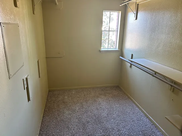 a view of an empty room with a window