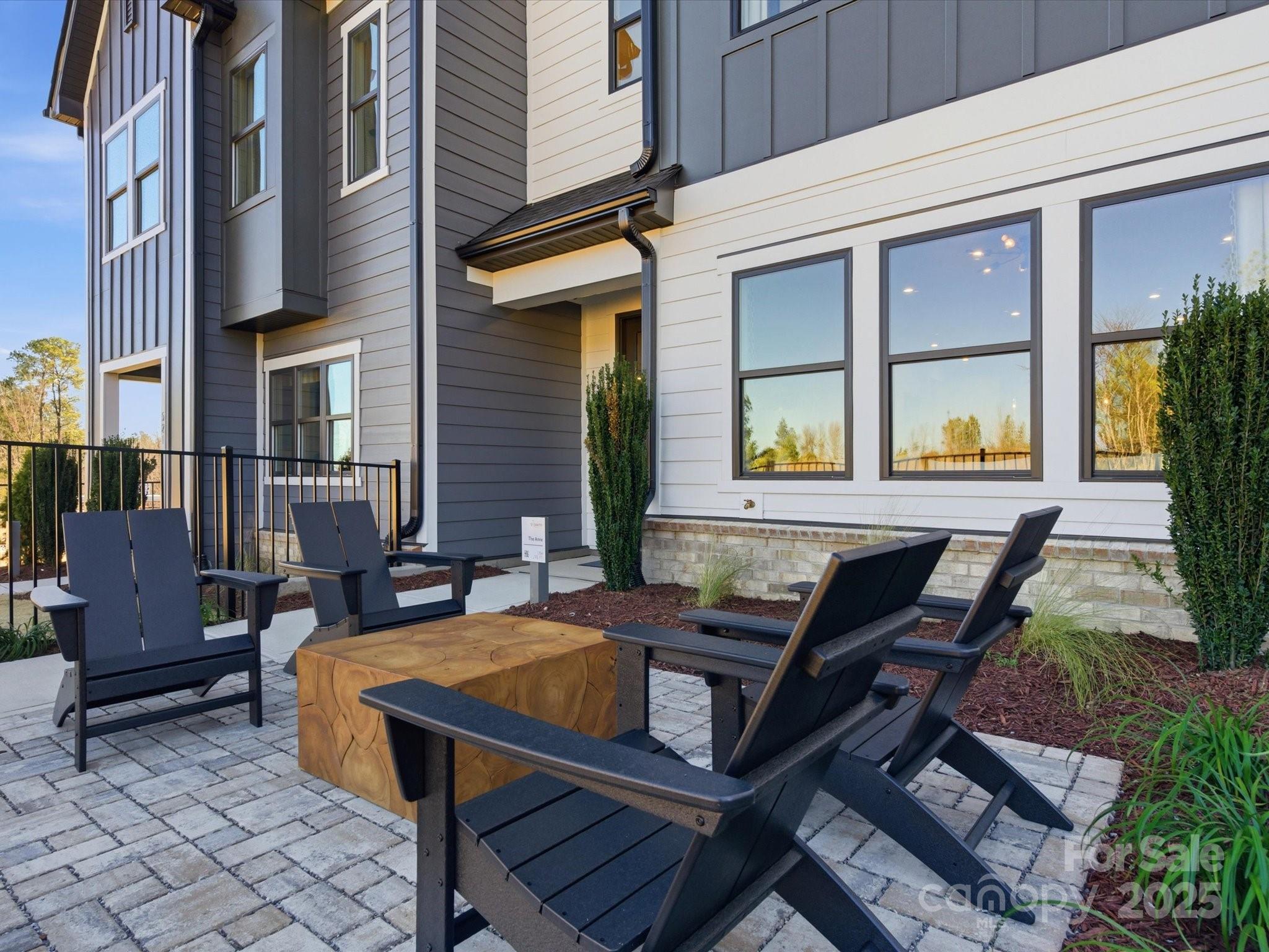 492 Nash Street Fort Mill, SC 29715 - Photo 1 of 28 a view of a patio with table and chairs with wooden floor and fence