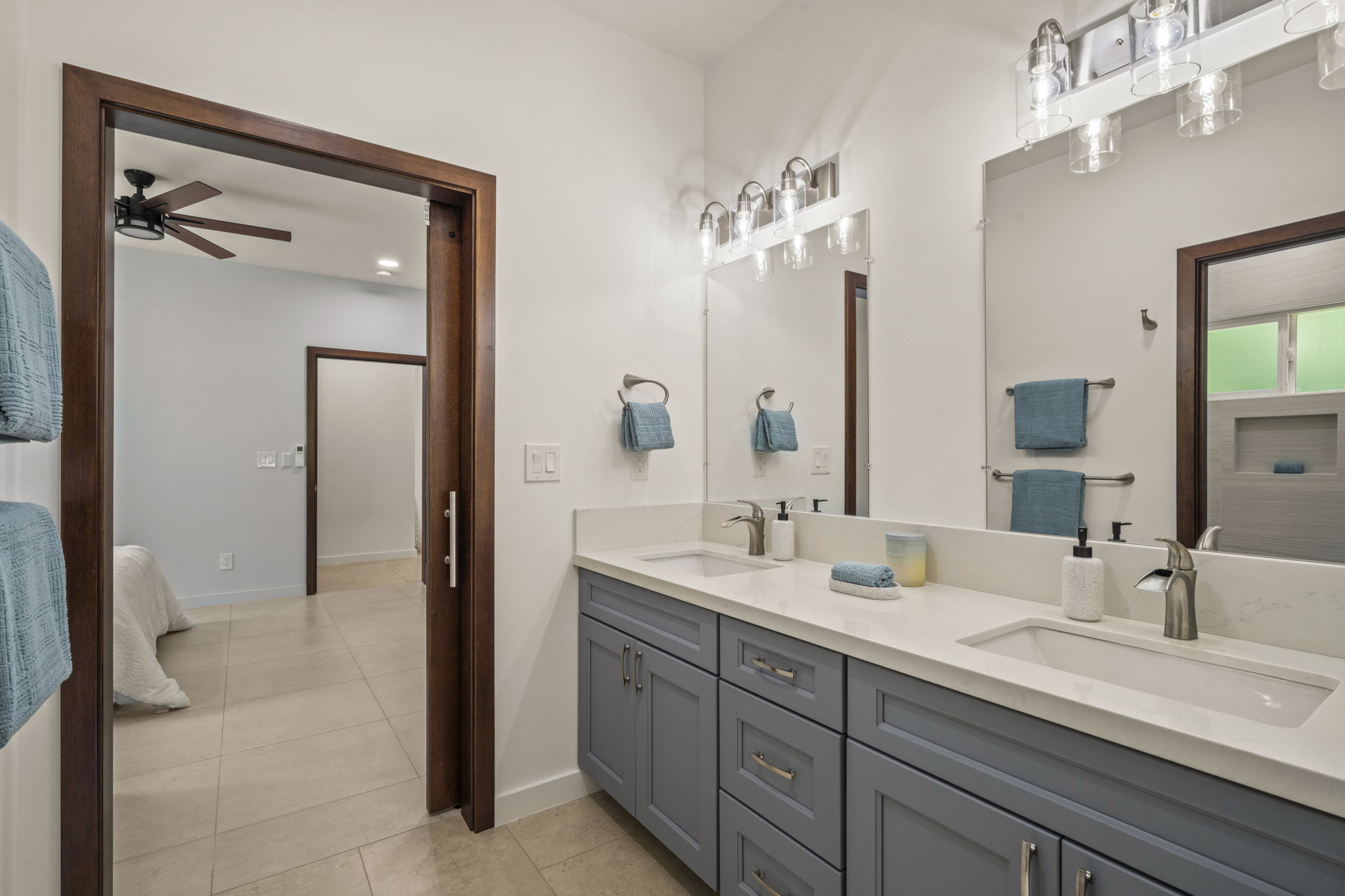 3582 Rice Street Lihue, HI 96766 - Photo 19 of 30 a bathroom with a double vanity sink and a mirror