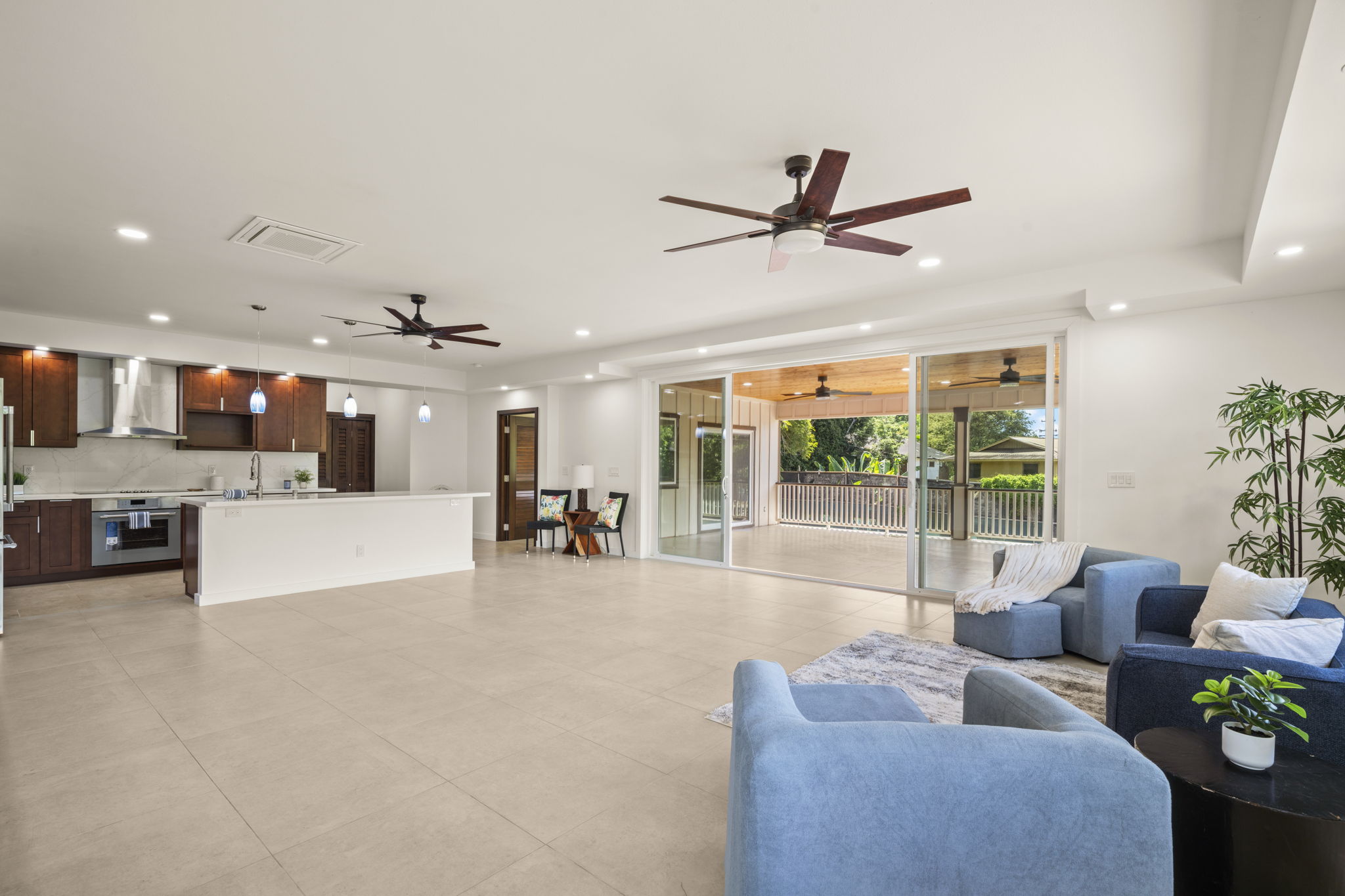 3582 Rice Street Lihue, HI 96766 - Photo 9 of 30 a living room with furniture and a large window with kitchen view