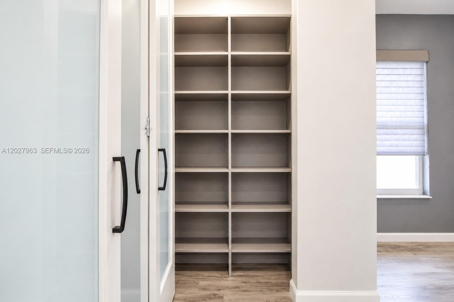 6646 Northwest 25th Terrace Boca Raton, FL 33496 - Photo 21 of 48 a view of closet area with empty racks