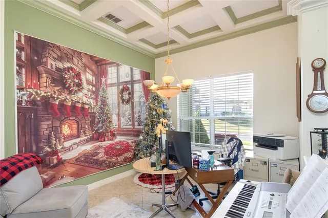 a living room with furniture potted plant and a large window
