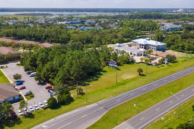 an aerial view of a houses with a lake view