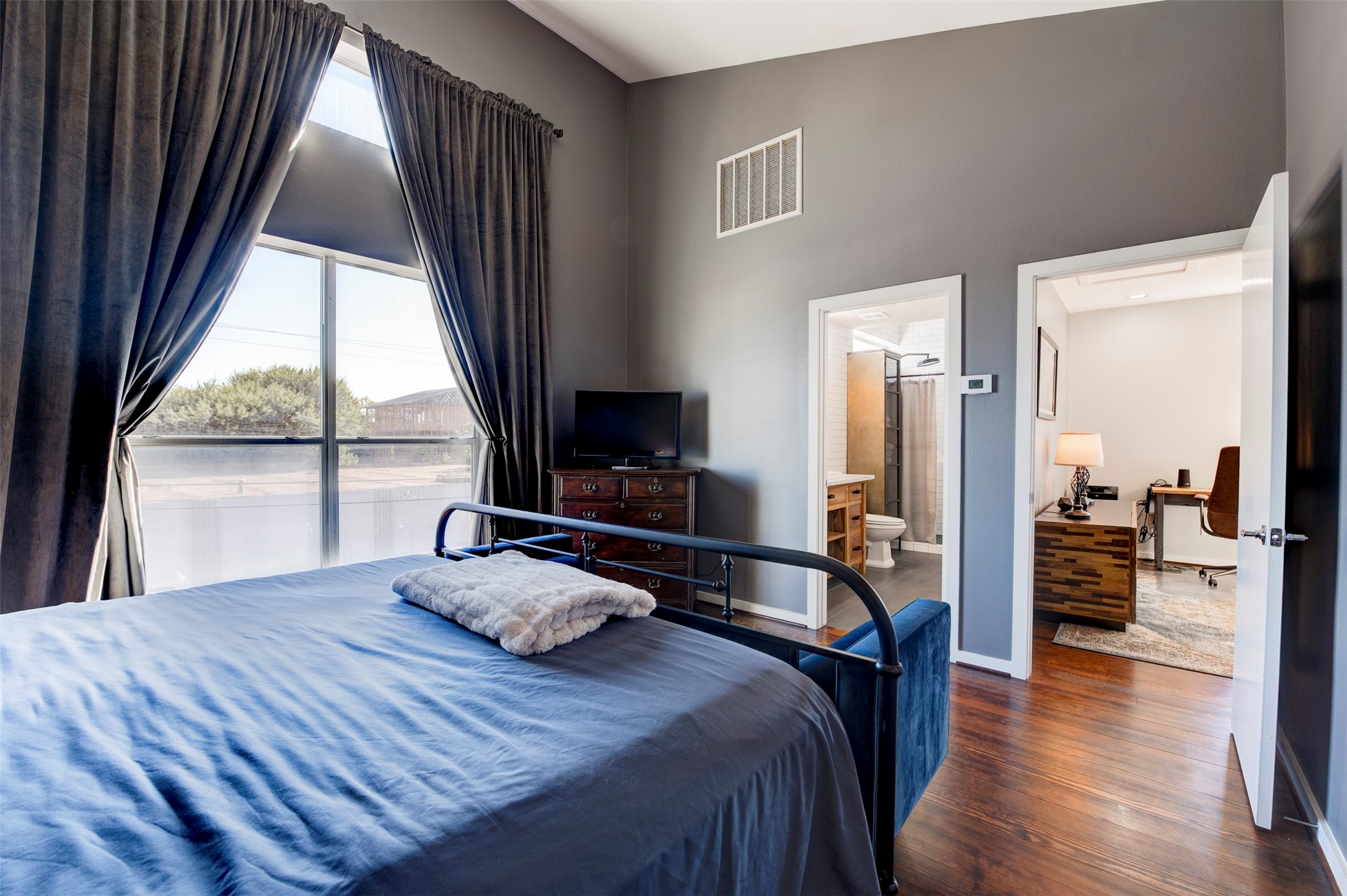 3050 Commerce Street Houston, TX 77003 - Photo 13 of 33 Primary bedroom on third floor with view to office area and en suite remodeled bathroom