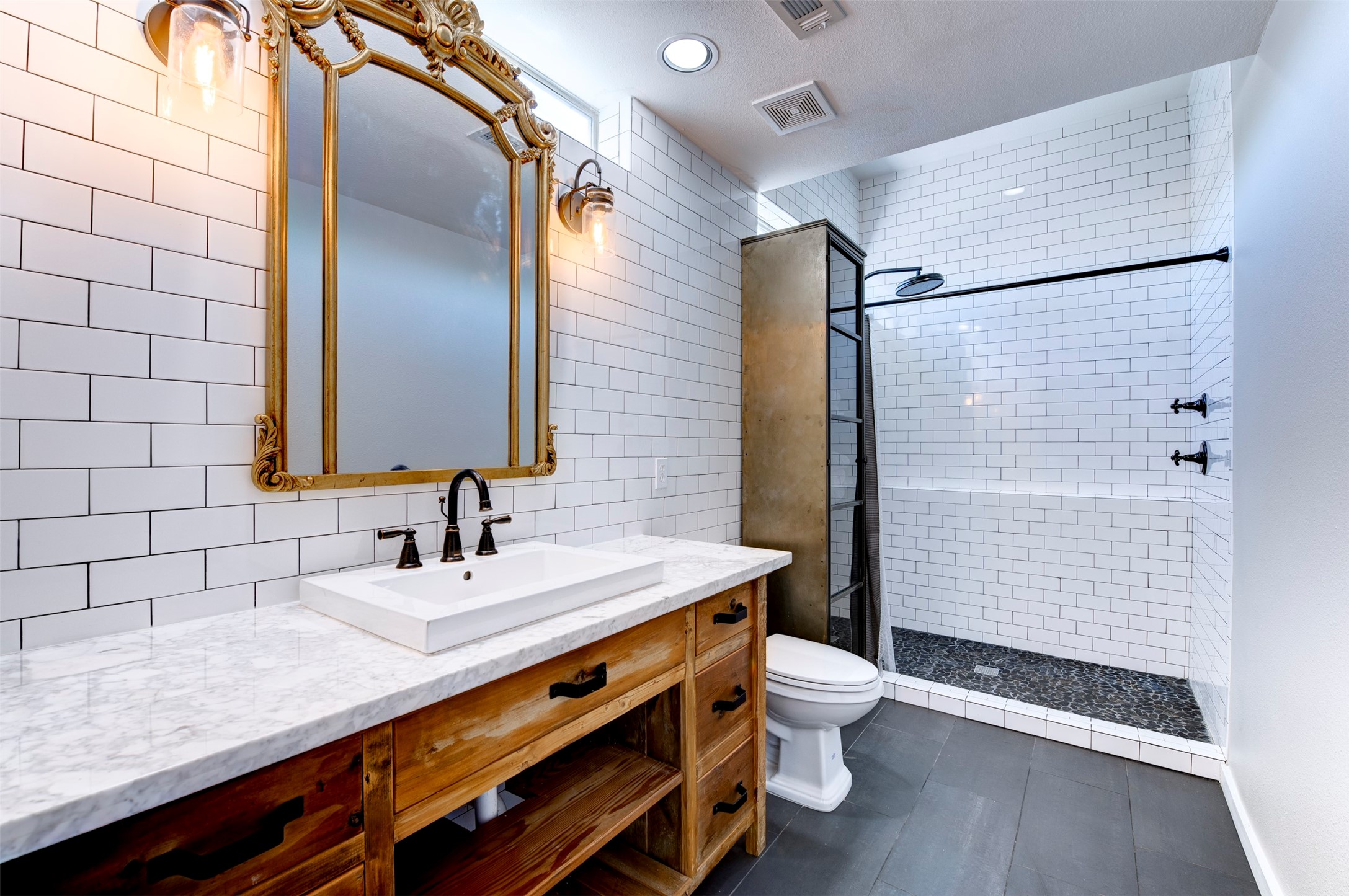 3050 Commerce Street Houston, TX 77003 - Photo 14 of 33 a bathroom with a sink a toilet and shower