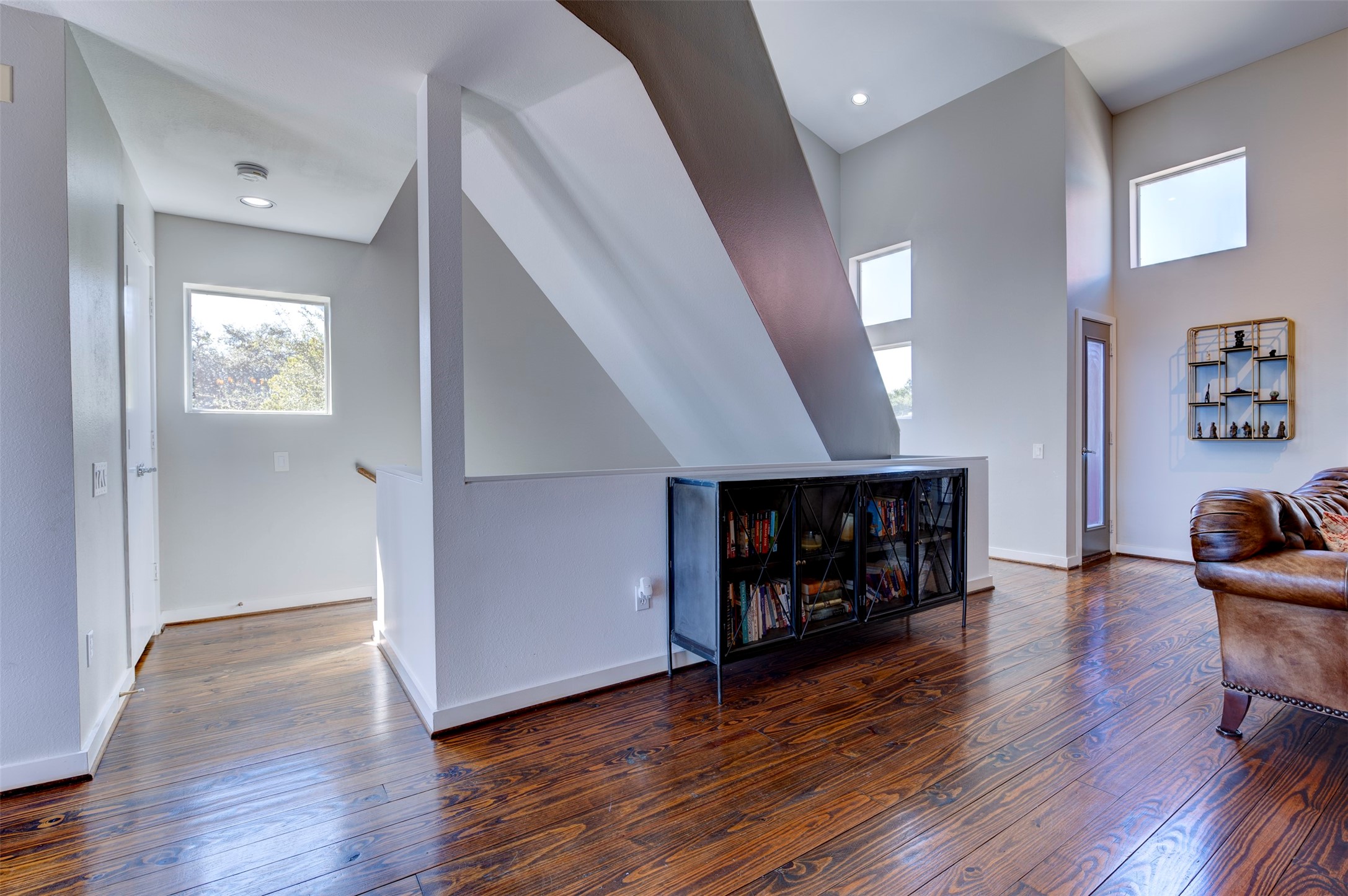 3050 Commerce Street Houston, TX 77003 - Photo 5 of 33 a view of an empty room with wooden floor and a window