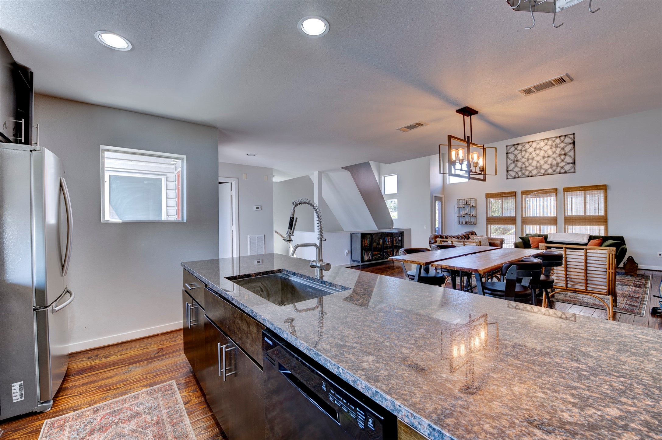 3050 Commerce Street Houston, TX 77003 - Photo 9 of 33 a kitchen with stainless steel appliances granite countertop a sink a stove and a refrigerator