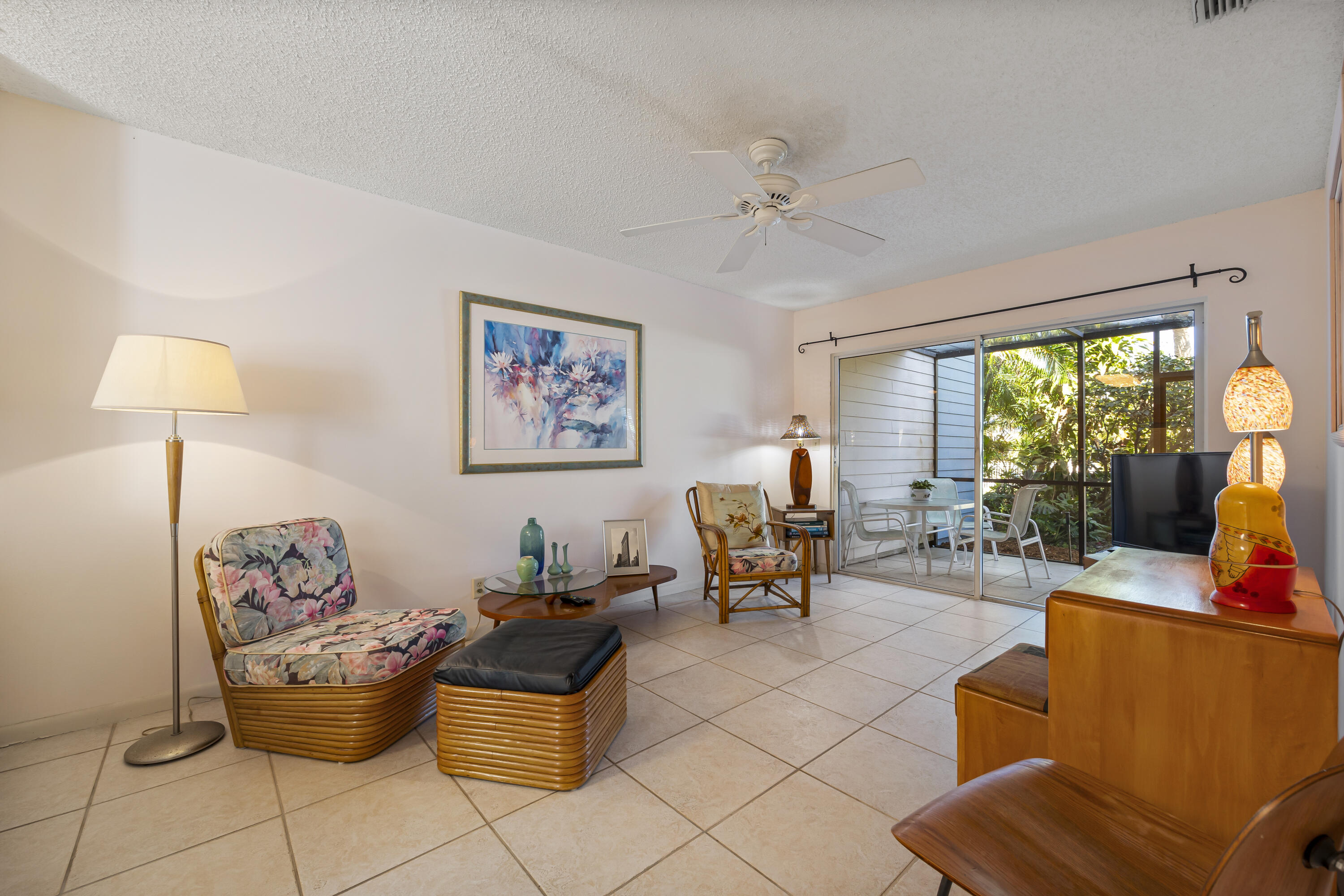 105 Ocean Dunes Circle Jupiter, FL 33477 - Photo 15 of 40 a living room with furniture and a large window