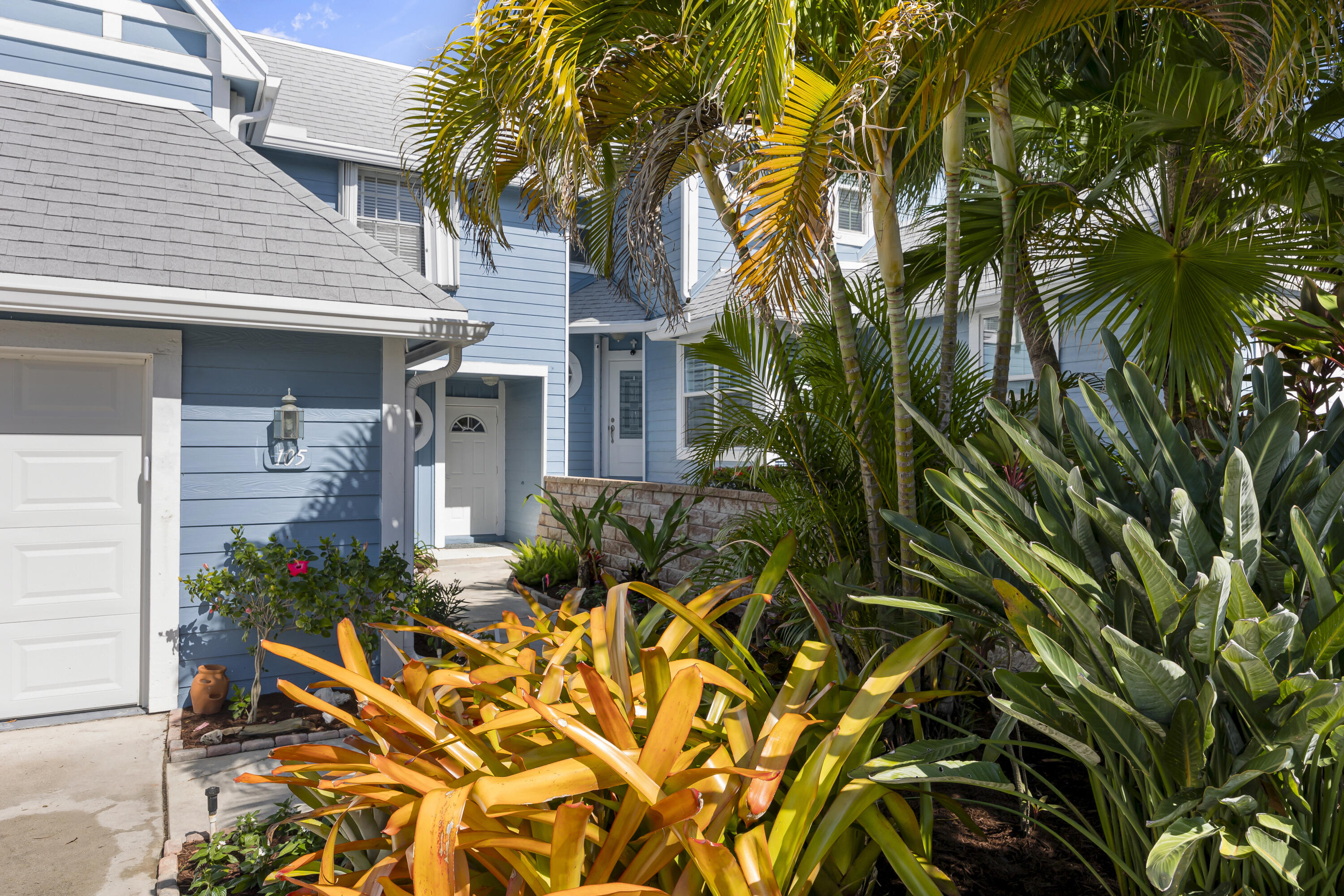 105 Ocean Dunes Circle Jupiter, FL 33477 - Photo 3 of 40 a view of an house with backyard and sitting area
