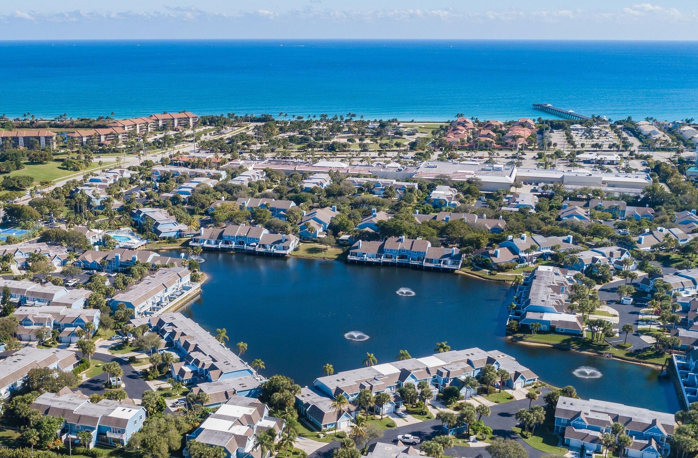105 Ocean Dunes Circle Jupiter, FL 33477 - Photo 36 of 40 an aerial view of a houses with a lake