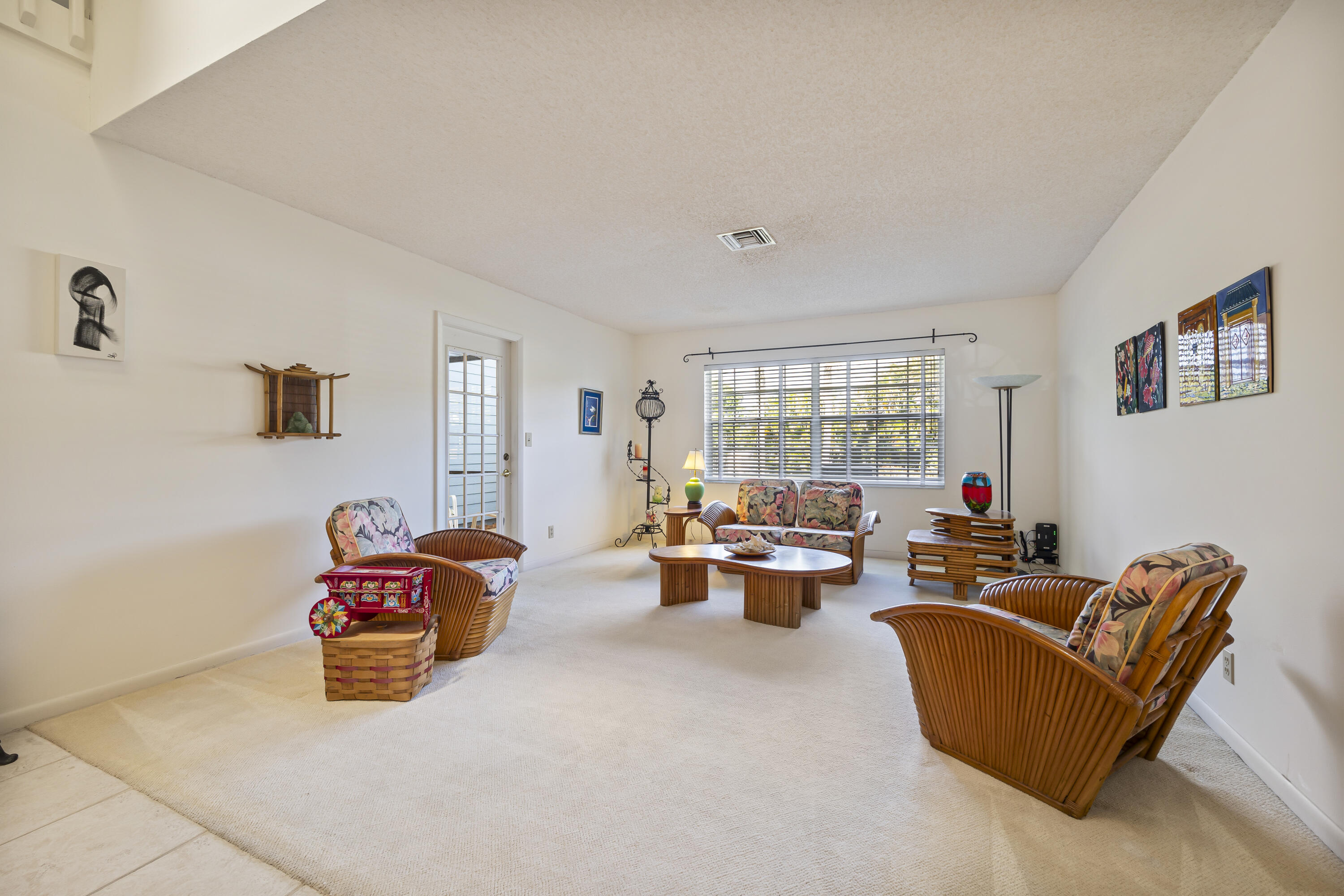 105 Ocean Dunes Circle Jupiter, FL 33477 - Photo 8 of 40 a living room with furniture and a large window