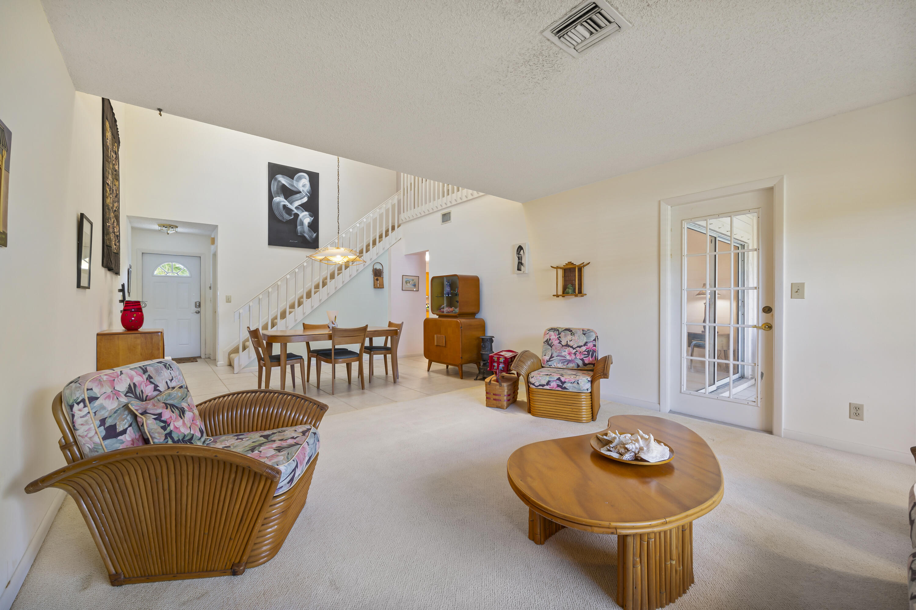 105 Ocean Dunes Circle Jupiter, FL 33477 - Photo 10 of 40 a living room with furniture and a table