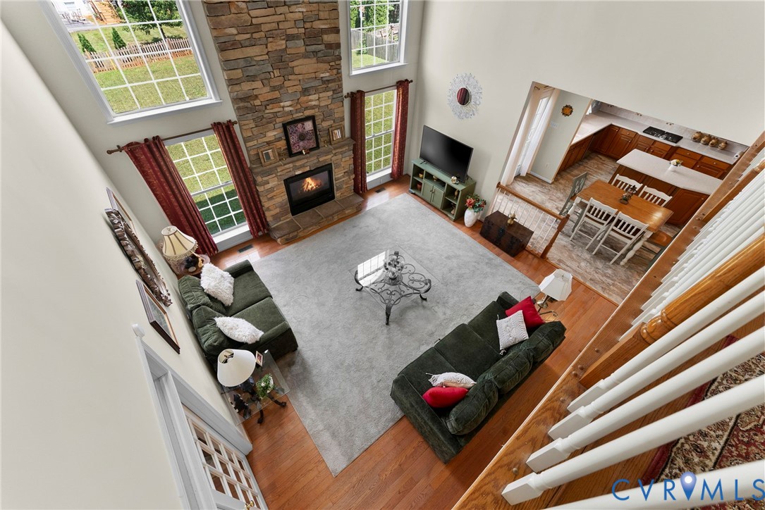 753 Blossom Tree Road Culpeper, VA 22701 - Photo 44 of 68 Two-story living area featuring a stone fireplace