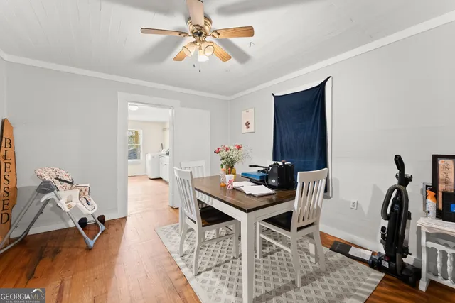 a view of a workspace with furniture and a workspace