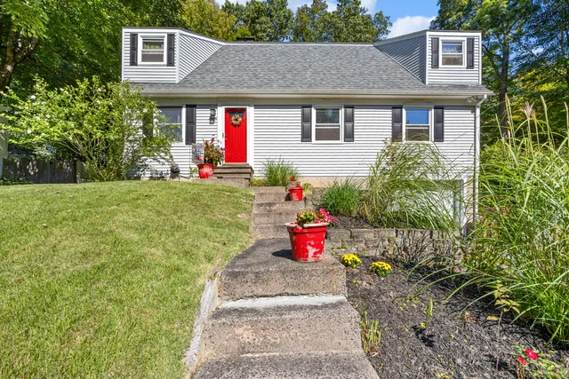 a front view of a house with a yard