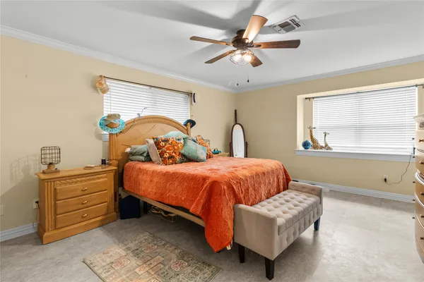 a bedroom with a bed and window