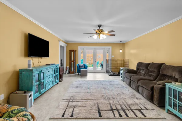 a living room with furniture and a flat screen tv