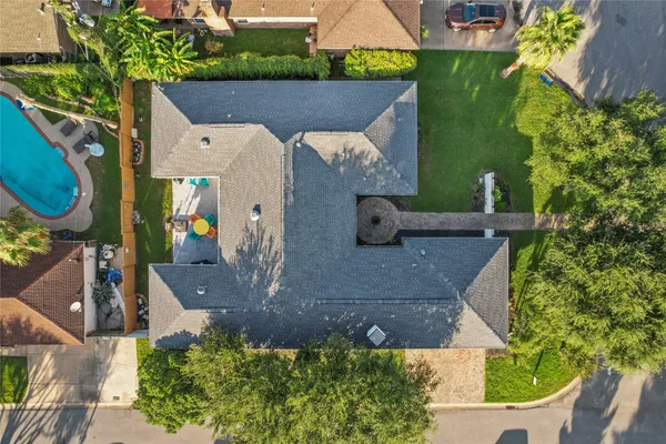 an aerial view of a house with a yard
