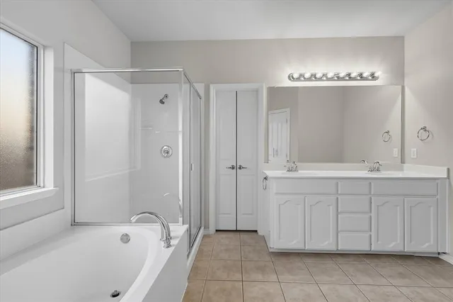 a bathroom with a bathtub and a sink