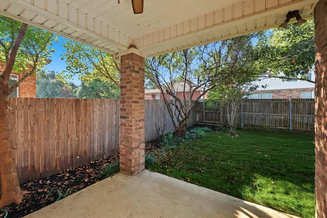 a view of a backyard with pathway