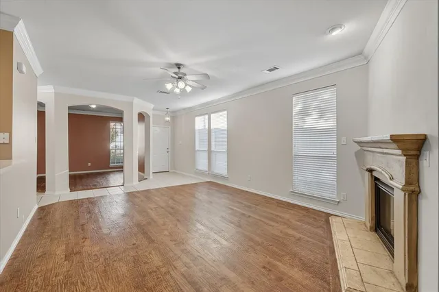 wooden floor in an empty room with a fireplace