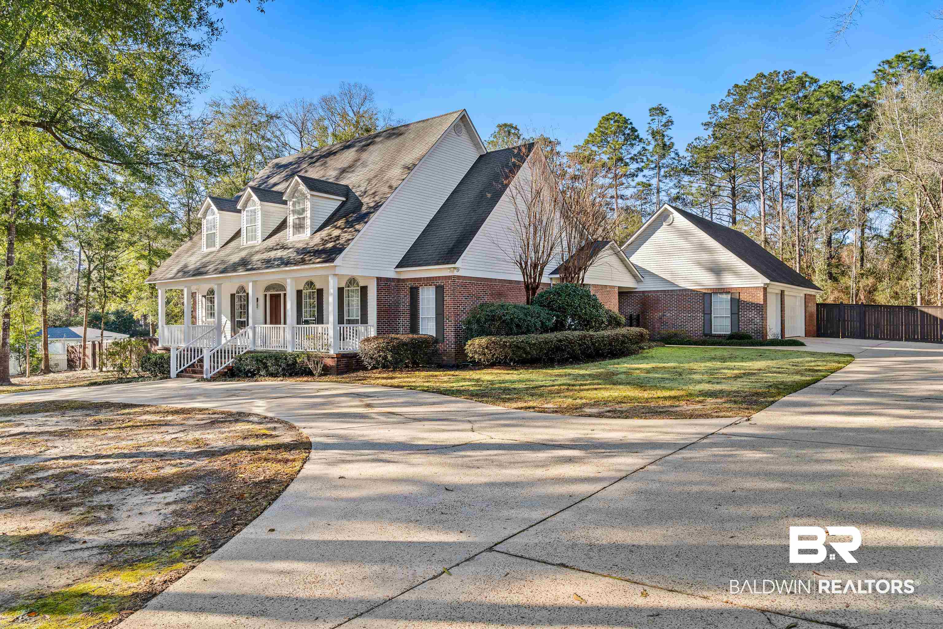 31267 Blakeley Ridge Court Spanish Fort, AL 36527 - Photo 42 of 61 View of front of home with covered porch, driveway, brick siding, and a front yard