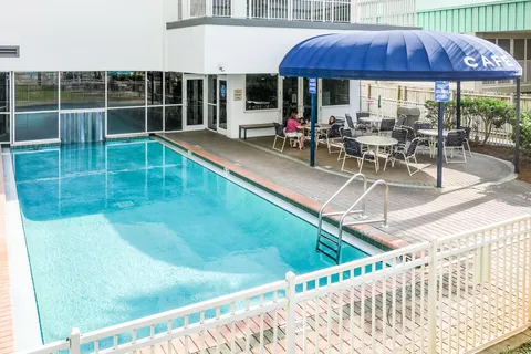 a view of a swimming pool with a lounge chairs