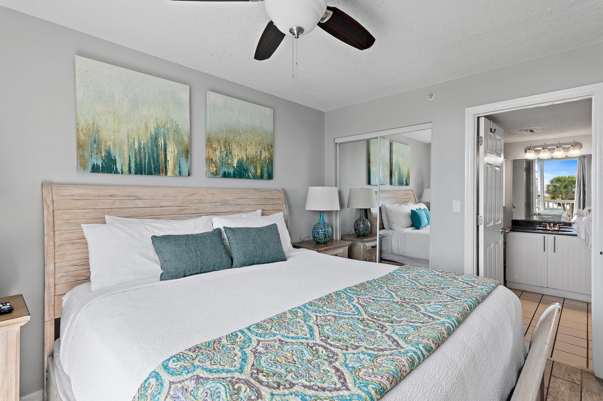 1002 Highway 98, Unit 217 Destin, FL 32541 - Photo 31 of 48 a bedroom with a large bed and a large window