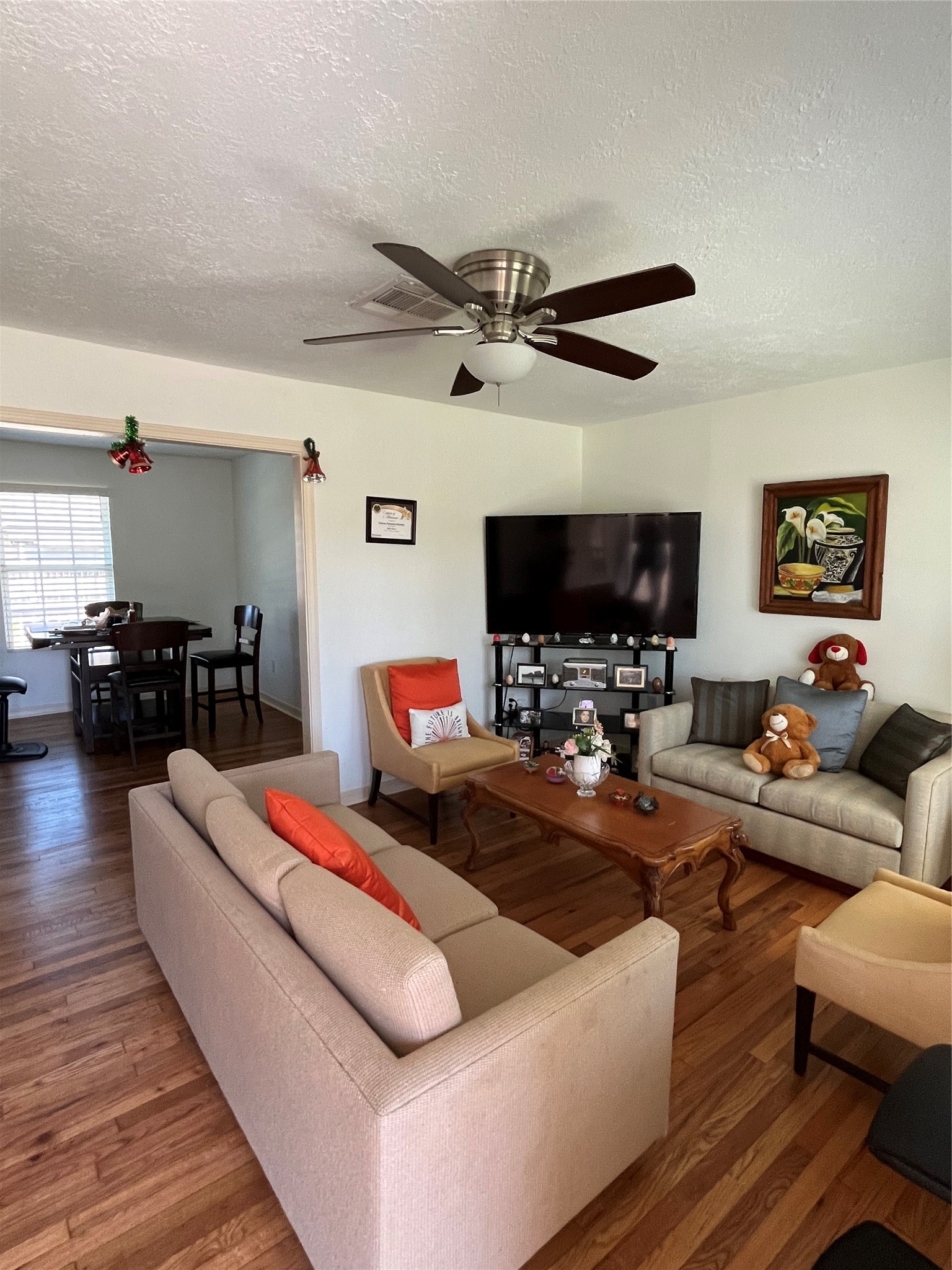 208 Oddo Street Houston, TX 77022 - Photo 2 of 10 a living room with furniture and a flat screen tv