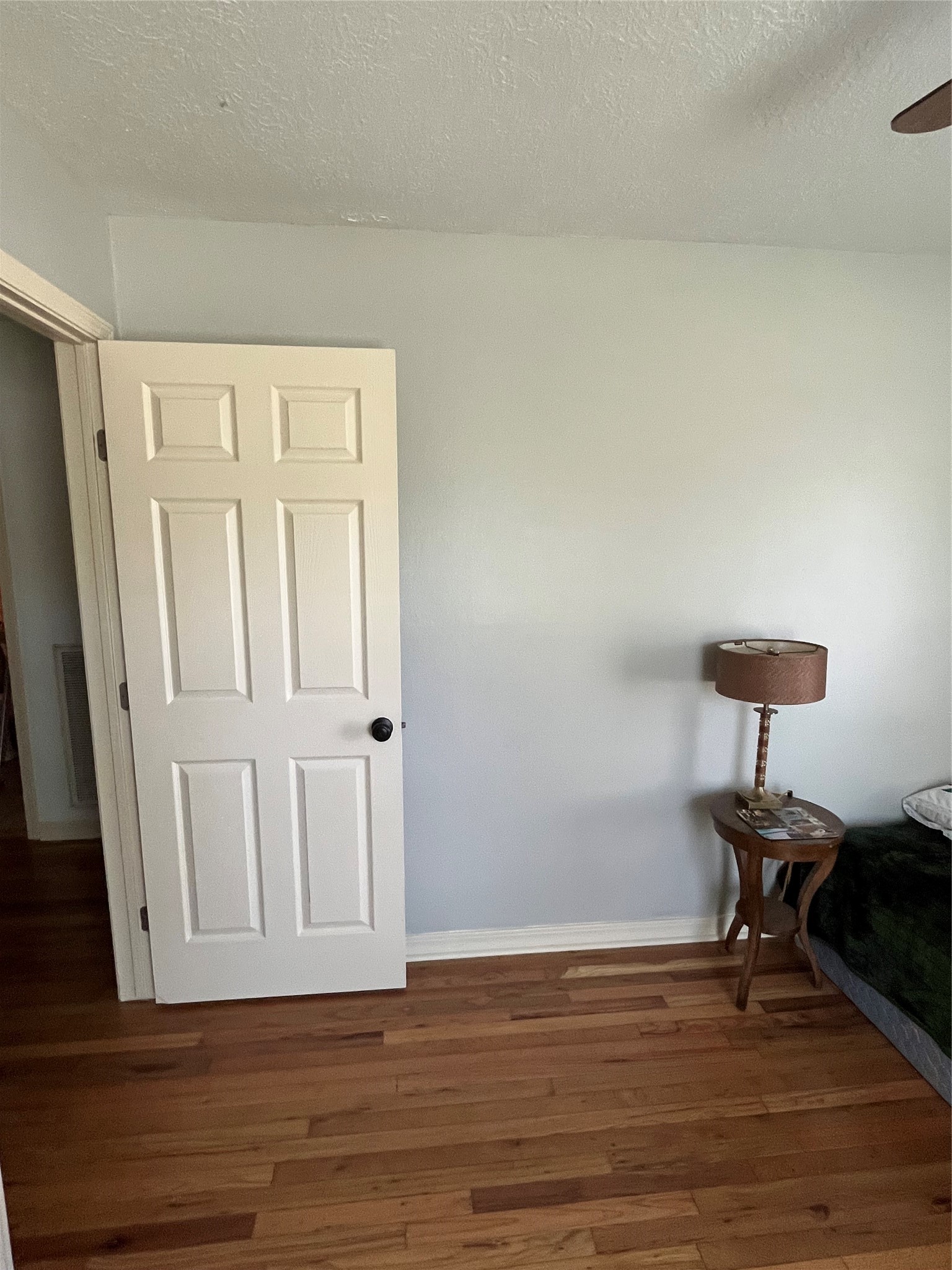 208 Oddo Street Houston, TX 77022 - Photo 4 of 10 a view of an empty room and wooden floor