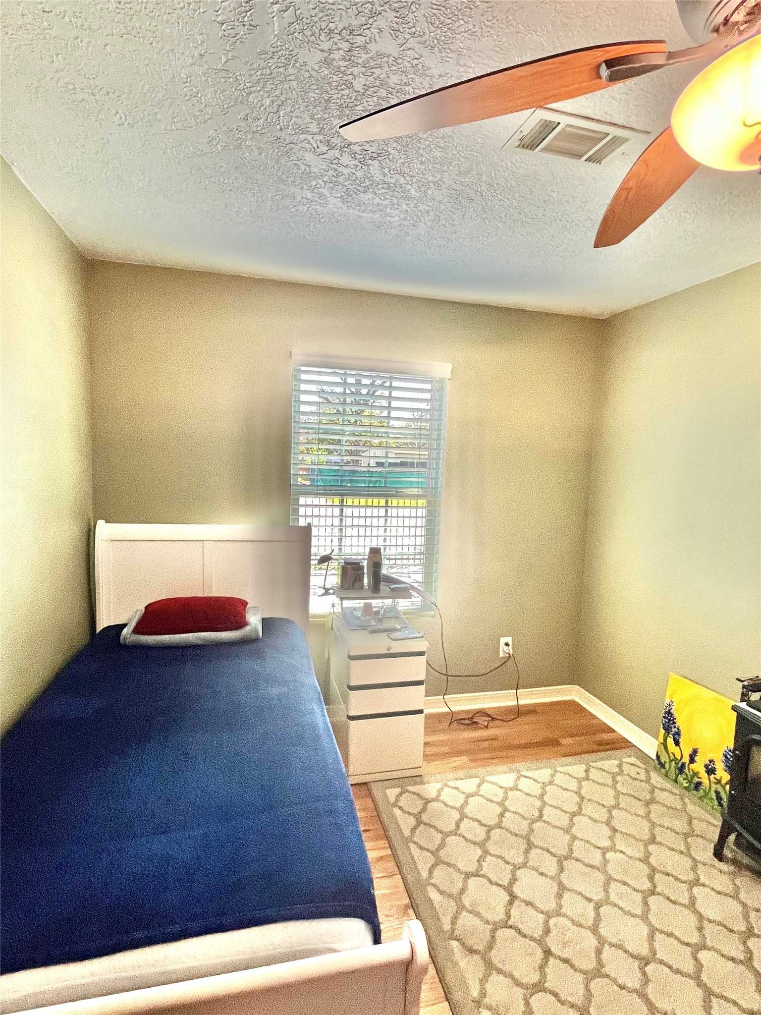 208 Oddo Street Houston, TX 77022 - Photo 6 of 10 a bedroom with a bed and a window