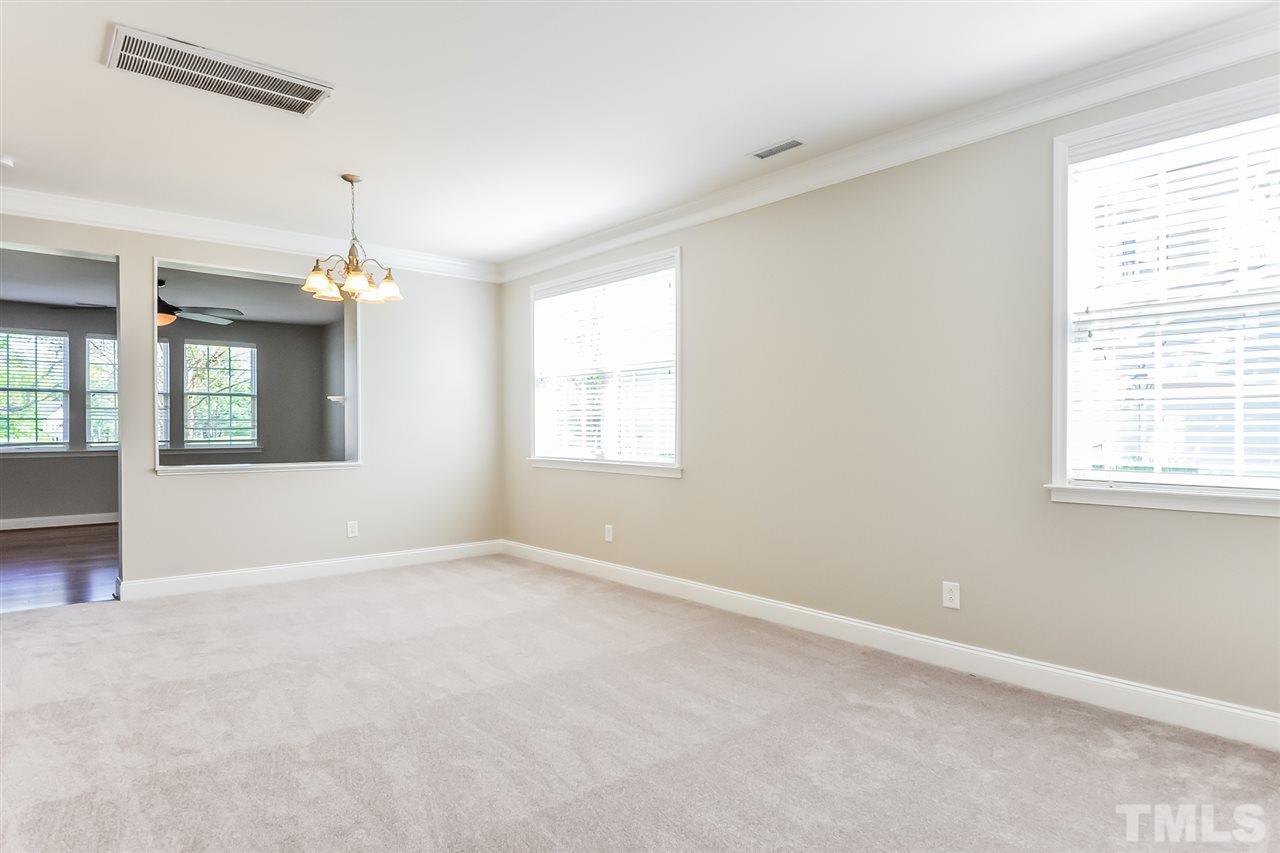 187 Solheim Lane Raleigh, NC 27603 - Photo 11 of 25 a view of an empty room with a window