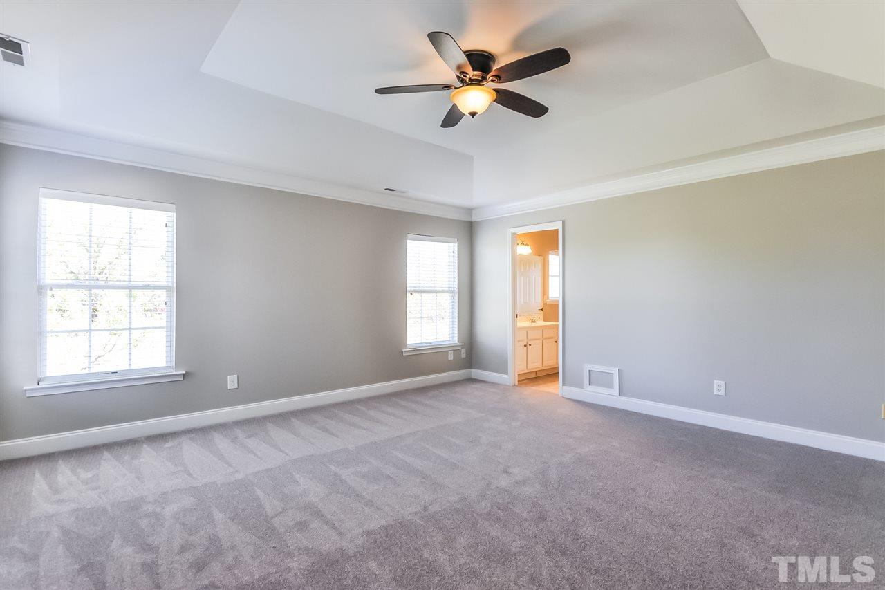 187 Solheim Lane Raleigh, NC 27603 - Photo 16 of 25 a view of an empty room with a window