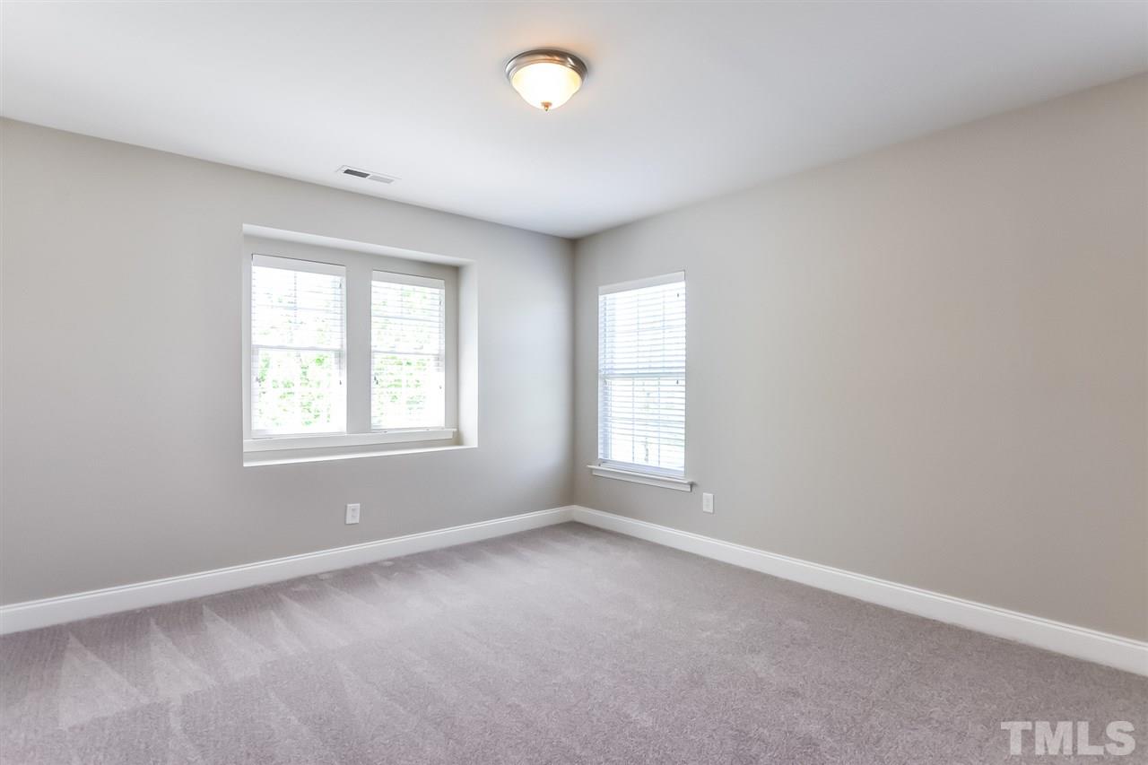 187 Solheim Lane Raleigh, NC 27603 - Photo 18 of 25 an empty room with windows